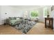 Spacious living room featuring a comfortable sofa, modern decor, and a large window at 1026 Jefferson Ave, Indianapolis, IN 46201