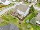 An aerial perspective shows the home's backyard deck, landscaping, and serene setting within the community at 10451 Meadow Lake Dr, Fishers, IN 46038