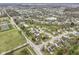 Wide aerial perspective of a community boasting attractive homes, lush greenery, and water features at 10451 Meadow Lake Dr, Fishers, IN 46038