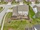 Drone shot capturing the property's layout, including the yard, deck, and screened-in porch at 10451 Meadow Lake Dr, Fishers, IN 46038