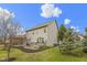 The home has a spacious backyard with a large, well-maintained lawn and mature trees offering shade and beauty at 10451 Meadow Lake Dr, Fishers, IN 46038