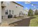 Home's backyard featuring a patio, landscaping, hot tub, and an outdoor grill—ideal for relaxing and entertaining at 10451 Meadow Lake Dr, Fishers, IN 46038