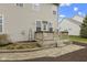 The home has a large backyard deck with lush landscaping, offering privacy and outdoor enjoyment at 10451 Meadow Lake Dr, Fishers, IN 46038