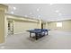 Finished basement featuring neutral carpet and a ping pong table for recreation at 10451 Meadow Lake Dr, Fishers, IN 46038