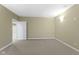 Unfurnished basement room with neutral carpet and a convenient doorway to another space at 10451 Meadow Lake Dr, Fishers, IN 46038