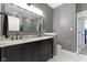 This updated bathroom features a double vanity, updated shower, and plenty of storage at 10451 Meadow Lake Dr, Fishers, IN 46038