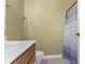 Bathroom featuring a vanity with a white sink, toilet, and a patterned shower curtain at 10451 Meadow Lake Dr, Fishers, IN 46038