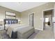 Bedroom with neutral carpet, natural light, ensuite bathroom, and modern decor at 10451 Meadow Lake Dr, Fishers, IN 46038