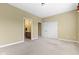 Bedroom featuring neutral carpeting, base trim, closet, and a bathroom at 10451 Meadow Lake Dr, Fishers, IN 46038