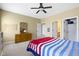 Bedroom with neutral carpet, sports memorabilia, ceiling fan, and natural light at 10451 Meadow Lake Dr, Fishers, IN 46038