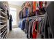 This walk-in closet offers ample storage with hanging racks and shelves for organization at 10451 Meadow Lake Dr, Fishers, IN 46038