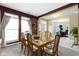 Dining area featuring a glass top table with 6 chairs, carpeted floors, and natural lighting at 10451 Meadow Lake Dr, Fishers, IN 46038