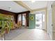 Inviting entryway and dining room featuring a green front door, neutral paint, and lots of natural light at 10451 Meadow Lake Dr, Fishers, IN 46038