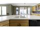 Bright kitchen features a large island with a sink and ample cabinet storage and dishwasher at 10451 Meadow Lake Dr, Fishers, IN 46038