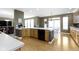 Open concept kitchen with modern appliances, wood floors, and a view to the dining area at 10451 Meadow Lake Dr, Fishers, IN 46038