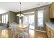 Eat-in kitchen with a wooden table and seating, plus a sliding door to the backyard at 10451 Meadow Lake Dr, Fishers, IN 46038
