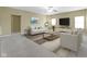 Bright living room offering stylish furnishings, neutral walls, and modern lighting for comfortable living at 10451 Meadow Lake Dr, Fishers, IN 46038