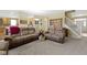 Open living area with a seamless flow from the living room to the kitchen and a staircase at 10451 Meadow Lake Dr, Fishers, IN 46038