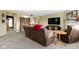 Inviting living room with carpet, fireplace, large-screen television and comfortable seating at 10451 Meadow Lake Dr, Fishers, IN 46038