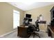 Bright office space with desk, multiple monitors, and plenty of natural light from the window at 10451 Meadow Lake Dr, Fishers, IN 46038