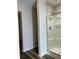 Bathroom with glass enclosed shower adjacent to opening with view into hall at 10622 Howe Rd, Fishers, IN 46038