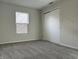 Bedroom with carpet, a window, and sliding closet doors at 10622 Howe Rd, Fishers, IN 46038