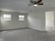 Bedroom featuring two windows and carpet at 10622 Howe Rd, Fishers, IN 46038