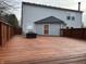 Spacious wooden deck with a fire pit, surrounded by a wooden fence, perfect for outdoor relaxation and entertaining at 10622 Howe Rd, Fishers, IN 46038