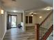 Inviting entryway with wood-look floors and decorative glass front door at 10622 Howe Rd, Fishers, IN 46038