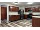 Kitchen featuring stainless steel appliances and wood cabinets at 10622 Howe Rd, Fishers, IN 46038