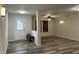 Inviting living room with wood-look flooring and lots of space at 10622 Howe Rd, Fishers, IN 46038
