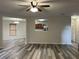 Open-concept living room, dining room and kitchen with modern floors at 10622 Howe Rd, Fishers, IN 46038