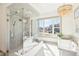 This bathroom has a glass enclosed shower, soaking tub, and a large window at 10756 Dartmoor Way, Zionsville, IN 46077