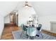 Bright bonus room features pitched ceiling, windows, and seating around a small table at 10756 Dartmoor Way, Zionsville, IN 46077