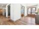 Spacious entryway showcasing the sitting room and front door with transom windows at 10756 Dartmoor Way, Zionsville, IN 46077