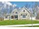 Beautiful two-story home featuring well-maintained landscaping and gray accents at 10756 Dartmoor Way, Zionsville, IN 46077