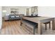 Beautifully staged game room features a pool table, hardwood floors, and a view to the kitchenette at 10756 Dartmoor Way, Zionsville, IN 46077
