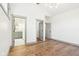 Bright main bedroom with hardwood floors, modern lighting, and ensuite bathroom access at 10756 Dartmoor Way, Zionsville, IN 46077