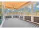 Covered back patio with wood ceiling and screen windows at 10756 Dartmoor Way, Zionsville, IN 46077