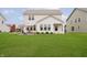Exterior view of a home with a well-maintained lawn and an inviting outdoor seating area at 1142 Cobra Dr, Franklin, IN 46131