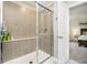 Modern bathroom featuring glass enclosed shower with chrome fixtures and neutral toned tile at 1142 Cobra Dr, Franklin, IN 46131