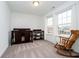 Bright Bedroom featuring a crib, changing table, and a rocking chair near a window at 1142 Cobra Dr, Franklin, IN 46131