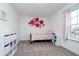 Cozy bedroom with decorative wall art and natural light from the window at 1142 Cobra Dr, Franklin, IN 46131