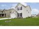 A beautiful suburban home shows off a large lawn and attached two car garage at 1142 Cobra Dr, Franklin, IN 46131