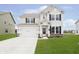 Charming two-story home with a well-manicured lawn and attached two car garage at 1142 Cobra Dr, Franklin, IN 46131