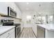 Bright kitchen with stainless steel appliances, marble countertops, and wood flooring, creating a seamless design at 1142 Cobra Dr, Franklin, IN 46131