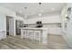 Modern kitchen with white cabinets, stainless steel appliances, and a center island with bar stools at 1142 Cobra Dr, Franklin, IN 46131