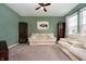 Inviting living room showcasing comfortable couches, stylish decor, and a ceiling fan at 1142 Cobra Dr, Franklin, IN 46131