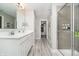 Modern main bathroom with double sinks, shower, and walk-in closet, providing a spa-like experience at 1142 Cobra Dr, Franklin, IN 46131