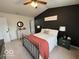 Main bedroom with dark paint, ceiling fan, a queen bed and bedside tables at 1197 N Aberdeen Dr, Franklin, IN 46131